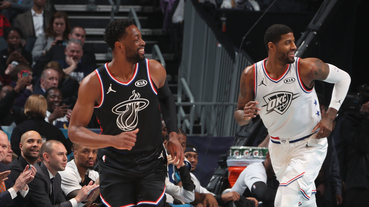 CHARLOTTE, NC - FEBRUARY 17: Dwyane Wade #3 of Team LeBron and Paul George #13 of Team Giannis smiles during the 2019 NBA All-Star Game on February 17, 2019 at the Spectrum Center in Charlotte, North Carolina. NOTE TO USER: User expressly acknowledges and agrees that, by downloading and/or using this photograph, user is consenting to the terms and conditions of the Getty Images License Agreement. Mandatory Copyright Notice: Copyright 2019 NBAE