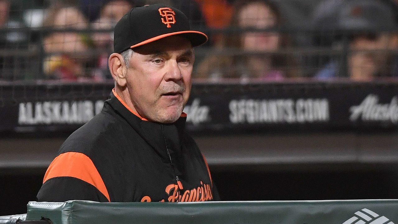 SAN FRANCISCO, CA - SEPTEMBER 14: Manager Bruce Bochy #15 of the San Francisco Giants looks on from the dugout against the Colorado Rockies in the bottom of the eighth inning at AT&T Park on September 14, 2018 in San Francisco, California.