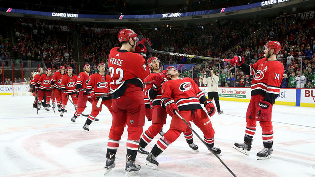 RALEIGH, NC - FEBRUARY 16: Members of the Carolina Hurricanes perform a limbo during the Storm Surge following a victory over the Dallas Stars during an NHL game on February 16, 2019 at PNC Arena in Raleigh, North Carolina.