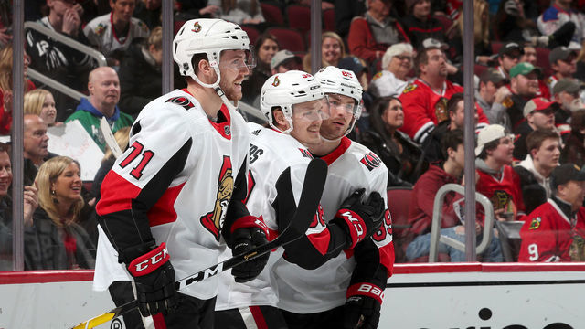 CHICAGO, IL - FEBRUARY 18: (L-R) Chris Tierney #71, Rudolfs Balcers #38 and Mikkel Boedker #89 of the Ottawa Senators celebrate after Balcers scored against the Chicago Blackhawks in the first period at the United Center on February 18, 2019 in Chicago, Illinois.