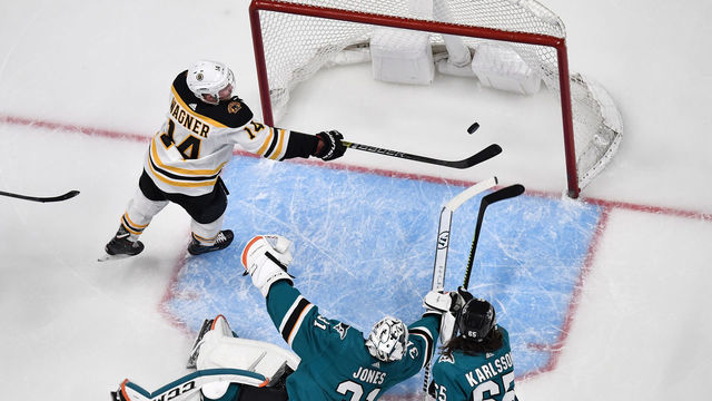 SAN JOSE, CA - FEBRUARY 18: An overhead view as Chris Wagner #14 of the Boston Bruins scores a goal against Martin Jones #31 of the San Jose Sharks at SAP Center on February 18, 2019 in San Jose, California