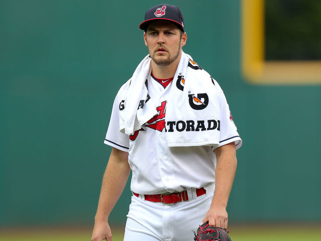 Cleveland Indians Trevor Bauer adorns a baseball with hair made