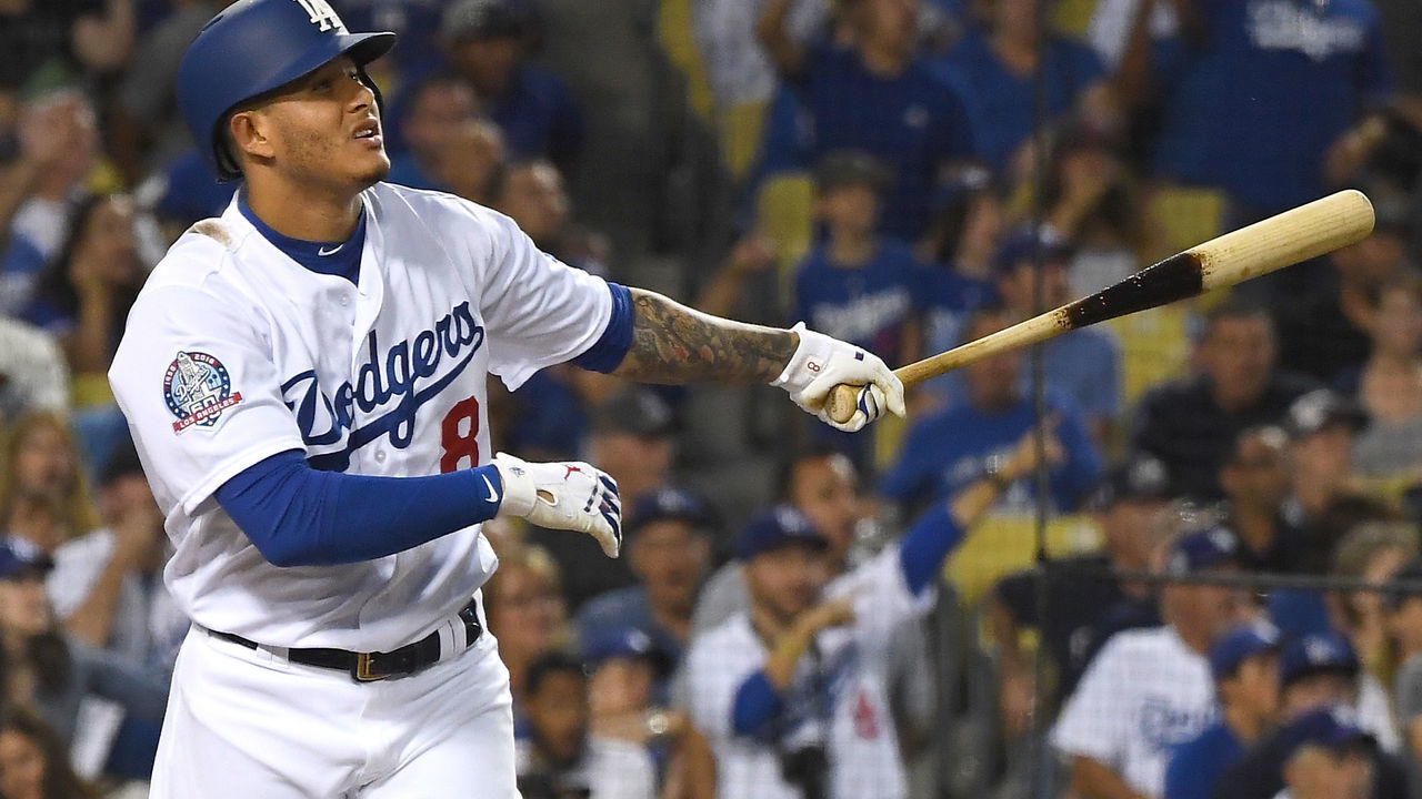 LOS ANGELES, CA - SEPTEMBER 22: Manny Machado #8 of the Los Angeles Dodgers hits a three-run home run in the third inning against the San Diego Padres at Dodger Stadium on September 22, 2018 in Los Angeles, California.