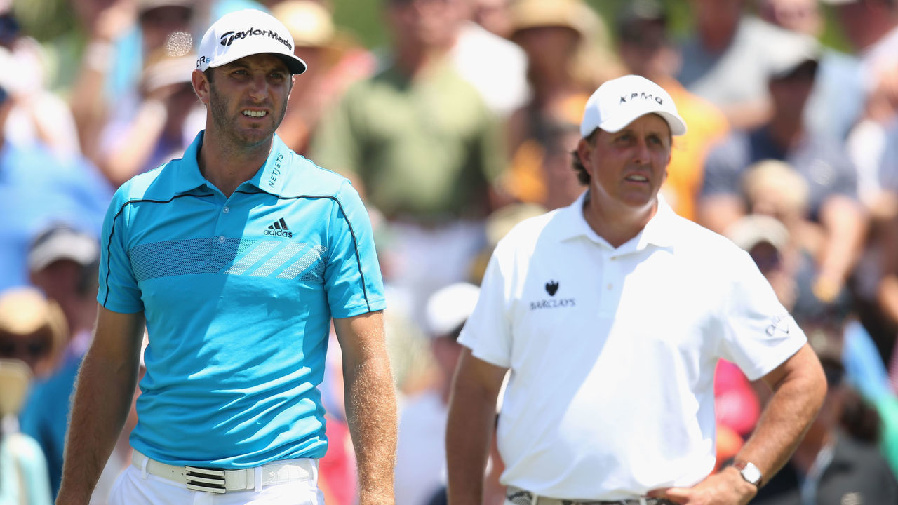 PONTE VEDRA BEACH, FL - MAY 09: Dustin Johnson and Phil Mickelson of the United States watches a shot on the third hole during the second round of THE PLAYERS Championship on The Stadium Course at TPC Sawgrass on May 9, 2014 in Ponte Vedra Beach, Florida.