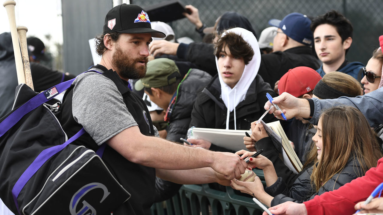 SCOTTSDALE, AZ - FEBRUARY 18: Colorado Rockies infielder Daniel Murphy signs autographs for the fans after practice at Salt River Fields February 18, 2019.