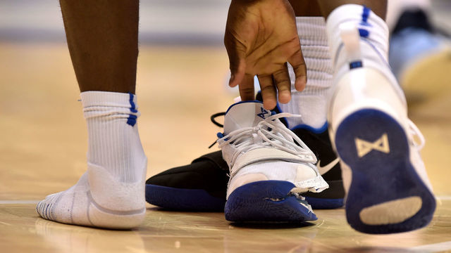DURHAM, NC - FEBRUARY 20: Zion Williamson #1 of the Duke Blue Devils picks up his broken shoe in the first half against the North Carolina Tar Heels at Cameron Indoor Stadium on February 20, 2019 in Durham, North Carolina.