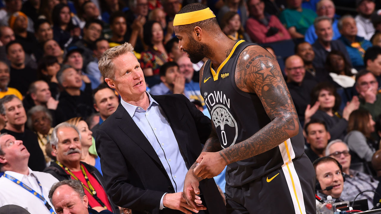 OAKLAND, CA - FEBRUARY 12: Head Coach Steve Kerr and DeMarcus Cousins #0 of the Golden State Warriors talk during the game against the Utah Jazz on February 12, 2019 at ORACLE Arena in Oakland, California. NOTE TO USER: User expressly acknowledges and agrees that, by downloading and/or using this photograph, user is consenting to the terms and conditions of Getty Images License Agreement. Mandatory Copyright Notice: Copyright 2019 NBAE