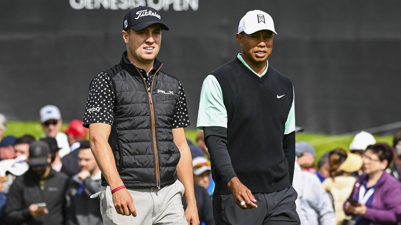 PACIFIC PALISADES, CA - FEBRUARY 15: Justin Thomas and Tiger Woods walk off the 10th hole tee box during the continuation of the first round of the Genesis Open at Riviera Country Club on February 15, 2019 in Pacific Palisades, California.