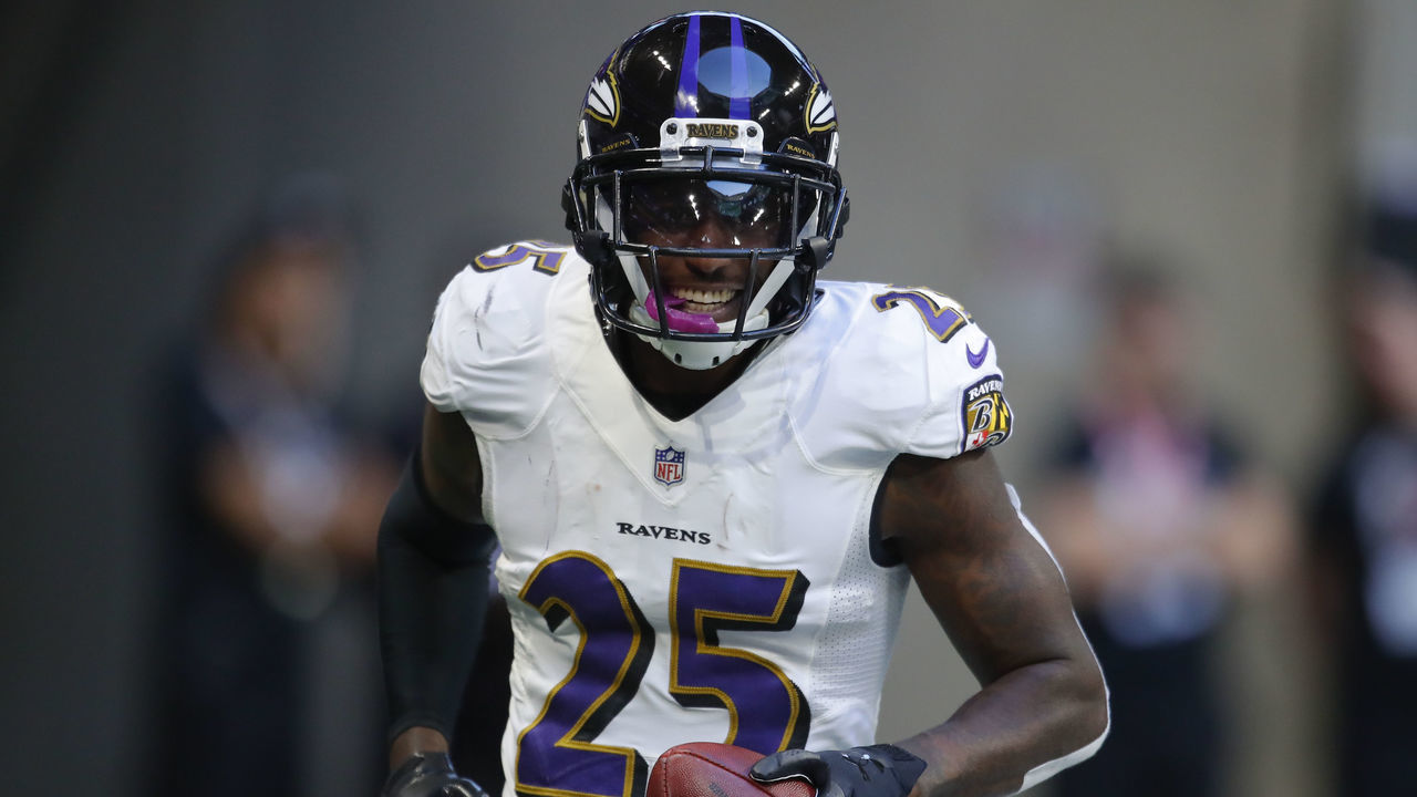 ATLANTA, GA - DECEMBER 02: Baltimore Ravens cornerback Tavon Young (25) celebrates after scoring a touchdown off a fumble in an NFL football game between the Baltimore Ravens and Atlanta Falcons on December 2, 2018 at Mercedes-Benz Stadium.