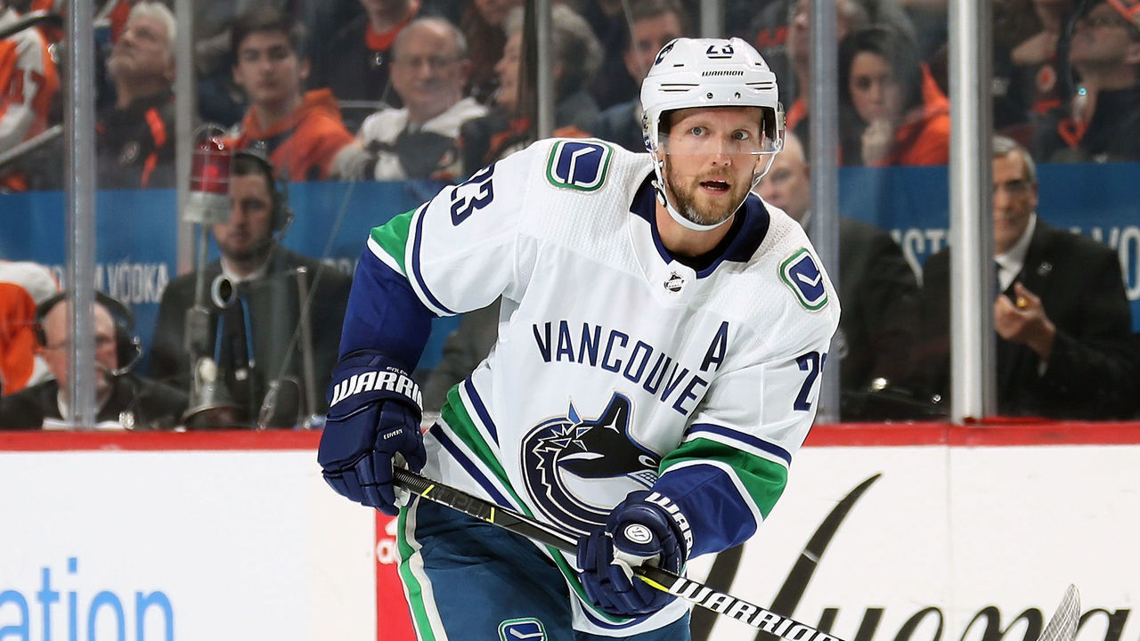 PHILADELPHIA, PA - FEBRUARY 04: Alexander Edler #23 of the Vancouver Canucks passes the puck against the Philadelphia Flyers on February 4, 2019 at the Wells Fargo Center in Philadelphia, Pennsylvania.