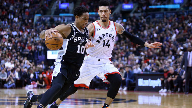 TORONTO, ON - FEBRUARY 22: DeMar DeRozan #10 of the San Antonio Spurs dribbles the ball as Danny Green #14 of the Toronto Raptors defends during the second half of an NBA game at Scotiabank Arena on February 22, 2019 in Toronto, Canada.
