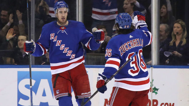 NEW YORK, NEW YORK - DECEMBER 14: Kevin Hayes #13 of the New York Rangers scores on the power-play at 17:26 of the first period against the Arizona Coyotes and is joined by Mats Zuccarello #36 at Madison Square Garden on December 14, 2018 in New York City.
