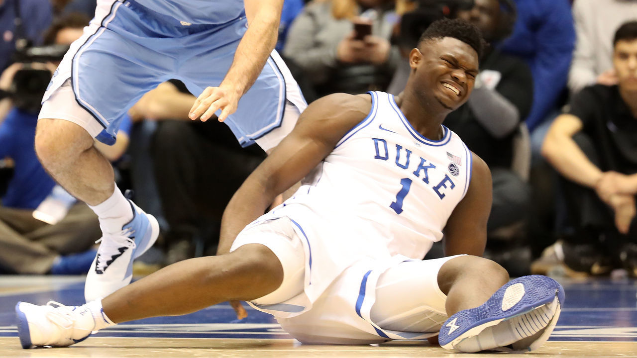DURHAM, NORTH CAROLINA - FEBRUARY 20: (EDITORS NOTE: Retransmission with alternate crop.) Zion Williamson #1 of the Duke Blue Devils reacts after falling as his shoe breaks in the first half of the game against the North Carolina Tar Heels at Cameron Indoor Stadium on February 20, 2019 in Durham, North Carolina.