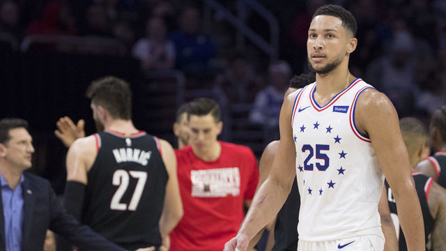 PHILADELPHIA, PA - FEBRUARY 23: Ben Simmons #25 of the Philadelphia 76ers walks to the bench as well as Jusuf Nurkic #27 of the Portland Trail Blazers during a timeout in the third quarter at the Wells Fargo Center on February 23, 2019 in Philadelphia, Pennsylvania. The Trail Blazers defeated the 76ers 130-115.