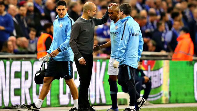LONDON, ENGLAND - FEBRUARY 24: Manchester City manager Josep Guardiola talks with Fernandinho of Manchester City after he was substituted during the Carabao Cup Final between Chelsea and Manchester City at Wembley Stadium on February 24, 2019 in London, England.