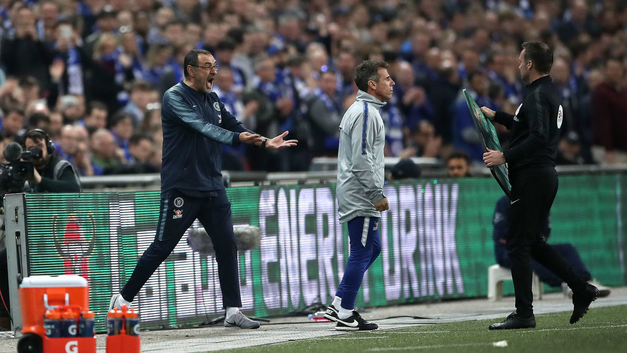 Chelsea manager Maurizio Sarri (left) reacts as his goalkeeper Kepa Arrizabalaga refuses to leave the pitch after his proposed substitution during the Carabao Cup Final at Wembley Stadium, London.