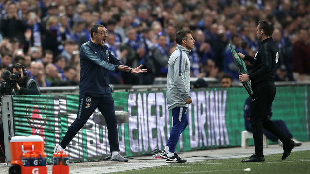 Chelsea manager Maurizio Sarri (left) reacts as his goalkeeper Kepa Arrizabalaga refuses to leave the pitch after his proposed substitution during the Carabao Cup Final at Wembley Stadium, London.
