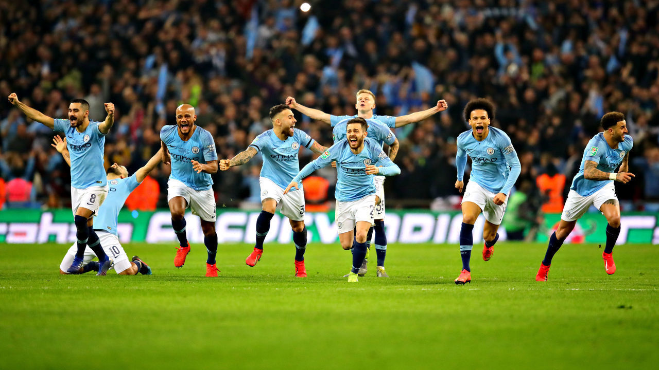 LONDON, ENGLAND - FEBRUARY 24: The Manchester City team celebrate after winning in the penalty shootout during the Carabao Cup Final between Chelsea and Manchester City at Wembley Stadium on February 24, 2019 in London, England.