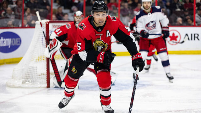OTTAWA, ON - FEBRUARY 22: Ottawa Senators defenseman Cody Ceci (5) closes distance on the play during third period National Hockey League action between the Columbus Blue Jackets and Ottawa Senators on February 22, 2019, at Canadian Tire Centre in Ottawa, ON, Canada.