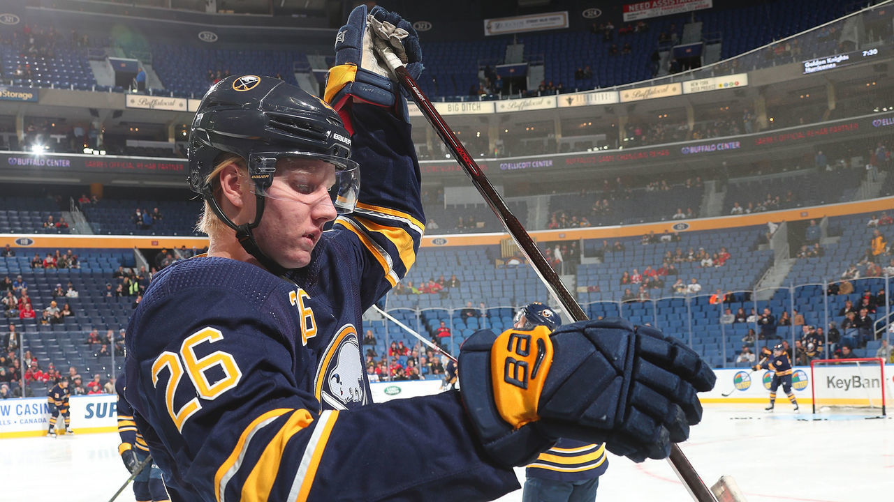 BUFFALO, NY - FEBRUARY 1: Rasmus Dahlin #26 of the Buffalo Sabres selects a stick before an NHL game against the Chicago Blackhawks on February 1, 2019 at KeyBank Center in Buffalo, New York.