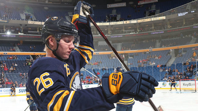 BUFFALO, NY - FEBRUARY 1: Rasmus Dahlin #26 of the Buffalo Sabres selects a stick before an NHL game against the Chicago Blackhawks on February 1, 2019 at KeyBank Center in Buffalo, New York.