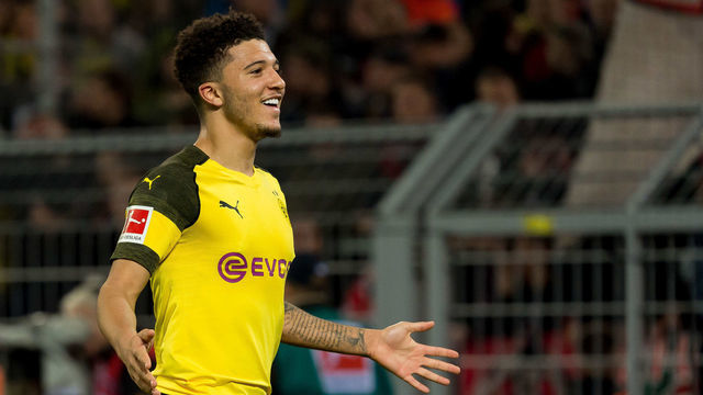 DORTMUND, GERMANY - FEBRUARY 24: Jadon Sancho of Borussia Dortmund celebrates after scoring his team's second goal during the Bundesliga match between Borussia Dortmund and Bayer 04 Leverkusen at Signal Iduna Park on February 24, 2019 in Dortmund, Germany.