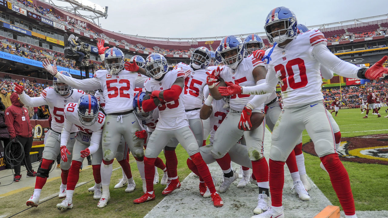 LANDOVER, MD - DECEMBER 09: New York Giants free safety Curtis Riley (35) celebrates with the rest of the defensive unit after intercepting a pass and returning it nine yards for a touchdown in the first quarter against the Washington Redskins on December 9, 2018, at FedEx Field in Landover, MD.