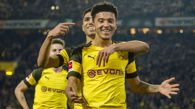 DORTMUND, GERMANY - FEBRUARY 24: Jadon Sancho of Borussia Dortmund celebrates scoring the goal to the 2:1 during the Bundesliga match between Borussia Dortmund and Bayer 04 Leverkusen at the Signal Iduna Park on February 24, 2019 in Dortmund, Germany.