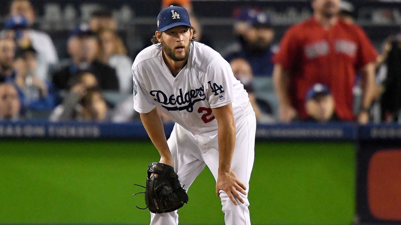 LOS ANGELES, CA - OCTOBER 28: Clayton Kershaw #22 of the Los Angeles Dodgers reacts after allowing a sixth inning home run to Mookie Betts (not pictured) #50 of the Boston Red Sox in Game Five of the 2018 World Series at Dodger Stadium on October 28, 2018 in Los Angeles, California.