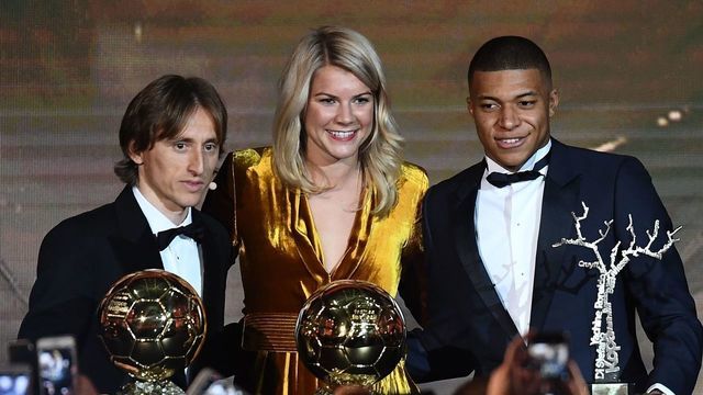 (FromL) 2018 Ballon d'Or awarded for best player of the year, Men's Ballon d'Or Real Madrid's Croatian midfielder Luka Modric, Women's Ballon d'Or Olympique Lyonnais' Norwegian forward Ada Hegerberg and Under-21 Ballon d'Or (Kopa trophy) Paris Saint-Germain's French forward Kylian Mbappe pose at the end of the 2018 Ballon d'Or award ceremony at the Grand Palais in Paris on December 3, 2018.