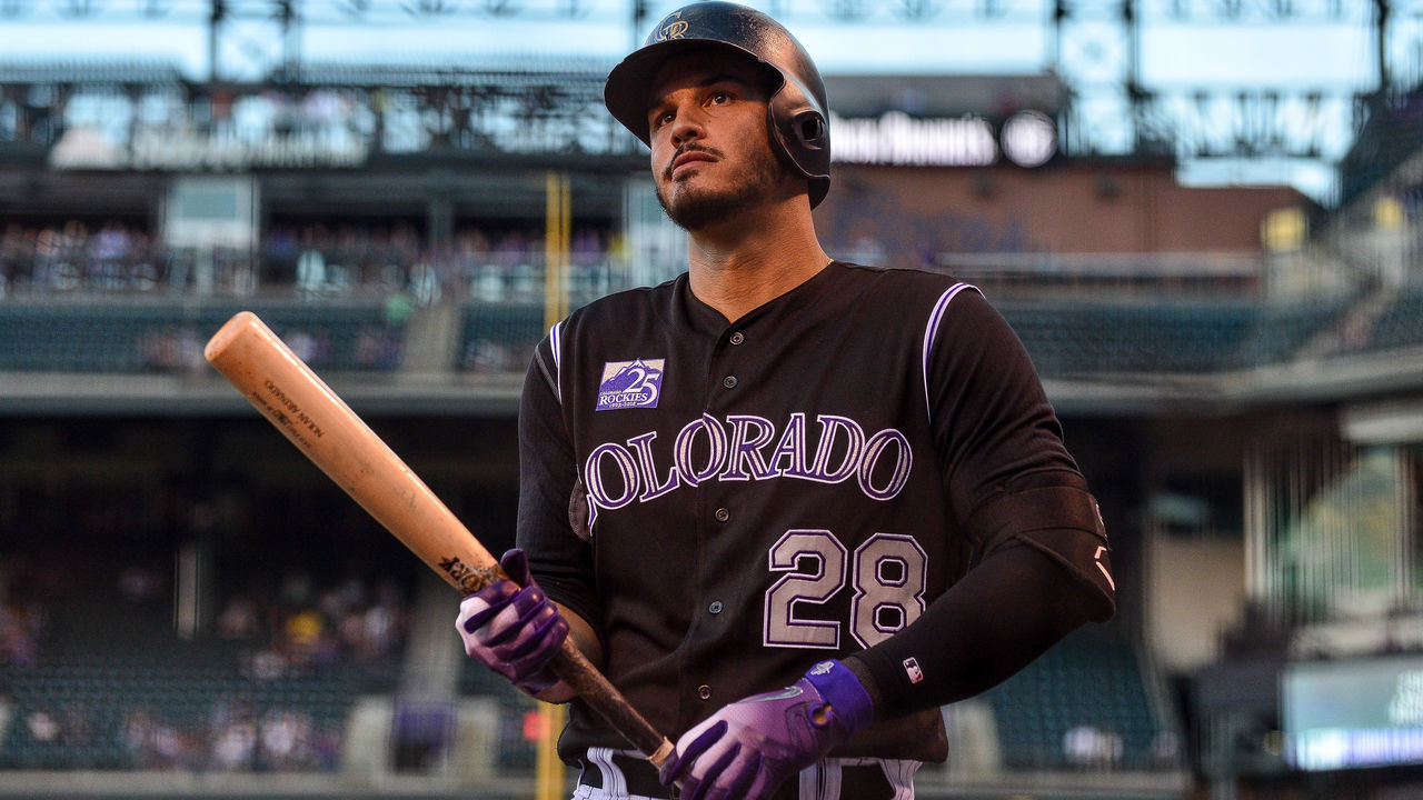 DENVER, CO - AUGUST 22: Nolan Arenado #28 of the Colorado Rockies prepares to bat against the San Diego Padres in the first inning of a game at Coors Field on August 22, 2018 in Denver, Colorado.