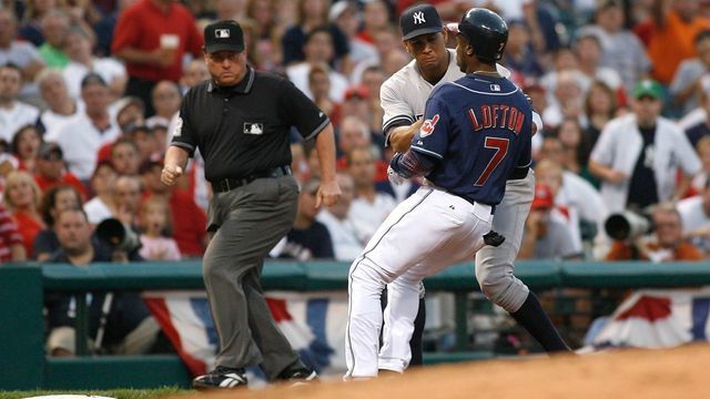 CLEVELAND - OCTOBER 05: Kenny Lofton #7 of the Cleveland Indians is tagged out, trying to steal third base, by Alex Rodriguez #13 of the New York Yankees during the bottom of the fifth inning of Game Two of the American League Divisional Series at Jacobs Field on October 5, 2007 in Cleveland, Ohio.