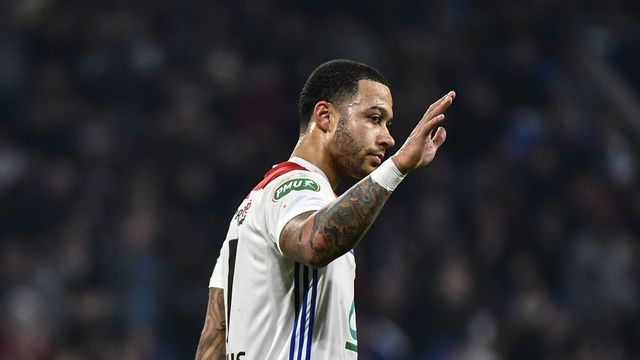 Lyon's Dutch forward Memphis Depay celebrates after scoring during the French Cup quarter-final football match between Olympique Lyonnais and Stade Malherbe Caen at the Groupama stadium in Decines-Charpieu, near Lyon, central-eastern France on February 27, 2019.