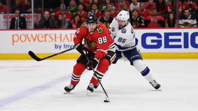 CHICAGO, IL - JANUARY 22: Chicago Blackhawks right wing Patrick Kane (88) controls the puck against Tampa Bay Lightning right wing Nikita Kucherov (86) during a game between the Chicago Blackhawks and the Tampa Bay Lightning on January 22, 2018, at the United Center in Chicago, IL.