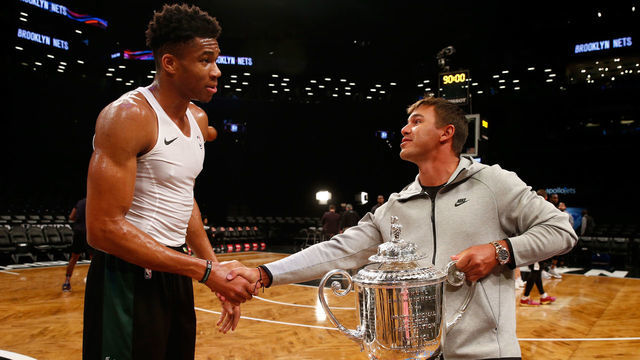 BROOKLYN, NY - FEBRUARY 04: PGA Championship Winner Brooks Koepka poses for a photo with Giannis Antetokounmpo #34 of the Milwaukee at Barclays Center on February 4, 2019 in Brooklyn, New York.