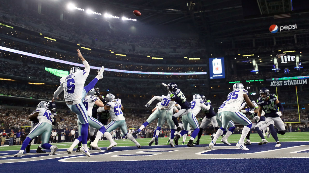 ARLINGTON, TEXAS - JANUARY 05: Chris Jones #6 of the Dallas Cowboys punts in the third quarter against the Seattle Seahawks during the Wild Card Round at AT&T Stadium on January 05, 2019 in Arlington, Texas.