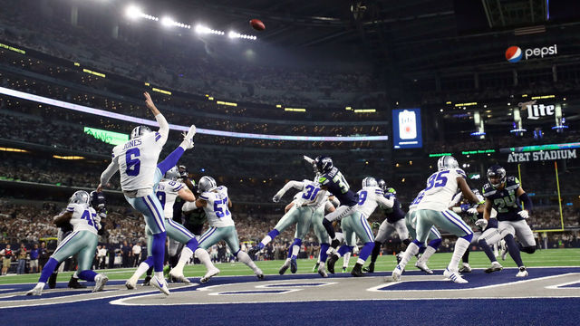 ARLINGTON, TEXAS - JANUARY 05: Chris Jones #6 of the Dallas Cowboys punts in the third quarter against the Seattle Seahawks during the Wild Card Round at AT&T Stadium on January 05, 2019 in Arlington, Texas.