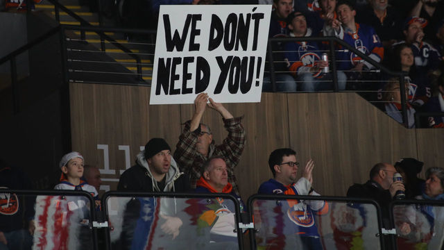 UNIONDALE, NEW YORK - FEBRUARY 28: Fans hold signs regarding John Tavares #91 of the Toronto Maple Leafs and his signing with that team this past summer at NYCB Live's Nassau Coliseum on February 28, 2019 in Uniondale City.