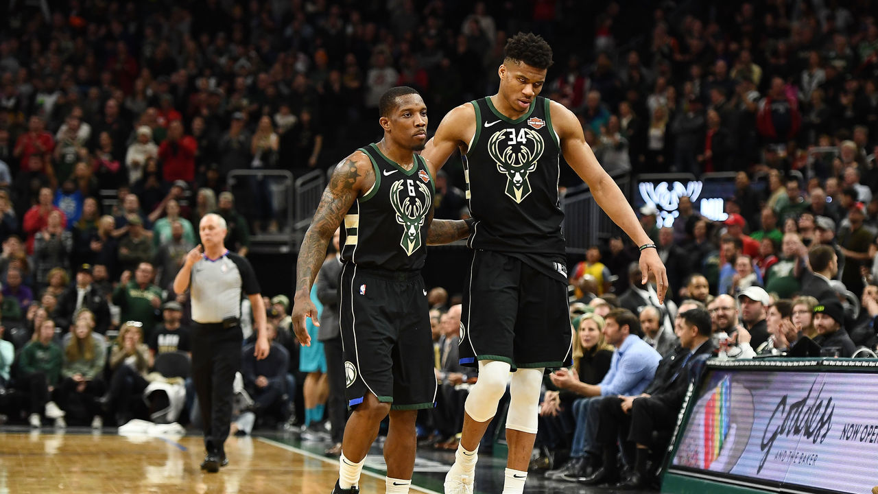 MILWAUKEE, WISCONSIN - JANUARY 25: Giannis Antetokounmpo #34 and Eric Bledsoe #6 of the Milwaukee Bucks walk to the bench during a game against the Charlotte Hornets at Fiserv Forum on January 25, 2019 in Milwaukee, Wisconsin.