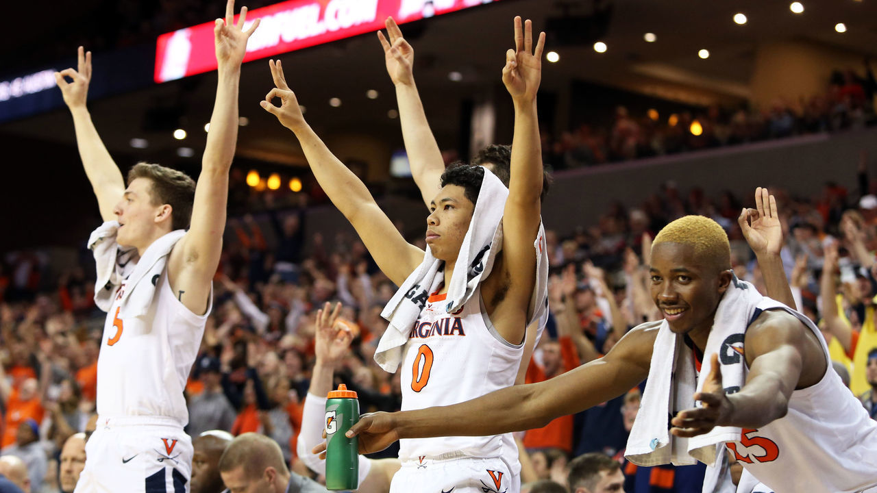 CHARLOTTESVILLE, VA - MARCH 02: Kihei Clark #0 and Mamadi Diakite #25 of the Virginia Cavaliers cheer from the bench in the second half during a game against the Pittsburgh Panthers at John Paul Jones Arena on March 2, 2019 in Charlottesville, Virginia.