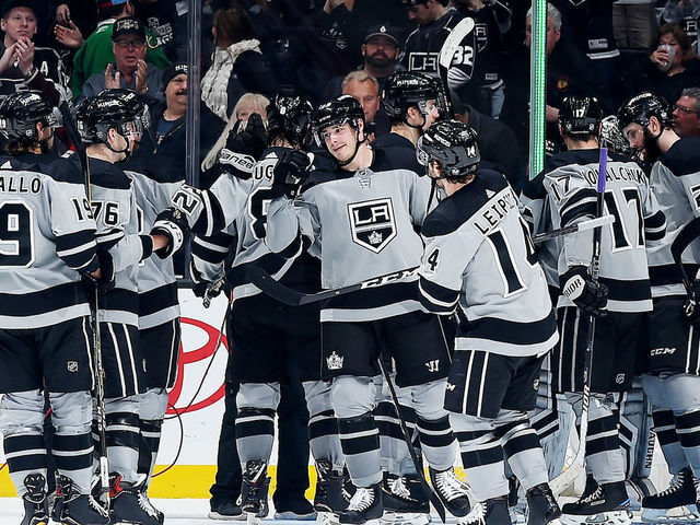 LOS ANGELES, CA - MARCH 2: Dustin Brown #23 of the Los Angeles Kings, center, celebrates with his team after defeating the Chicago Blackhawks 6-3 in the game at STAPLES Center on March 2, 2019 in Los Angeles, California. It was Brown's 1,100th NHL career game.