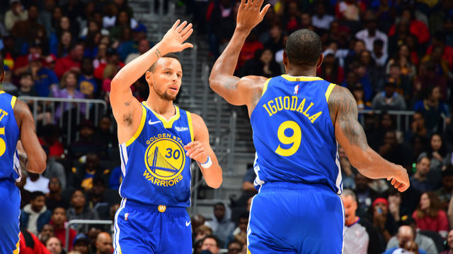 ATLANTA, GA - DECEMBER 3: Stephen Curry #30 and Andre Iguodala #9 of the Golden State Warriors celebrates during the game against the Atlanta Hawks on December 3, 2018 at State Farm Arena in Atlanta, Georgia. NOTE TO USER: User expressly acknowledges and agrees that, by downloading and/or using this Photograph, user is consenting to the terms and conditions of the Getty Images License Agreement. Mandatory Copyright Notice: Copyright 2018 NBAE