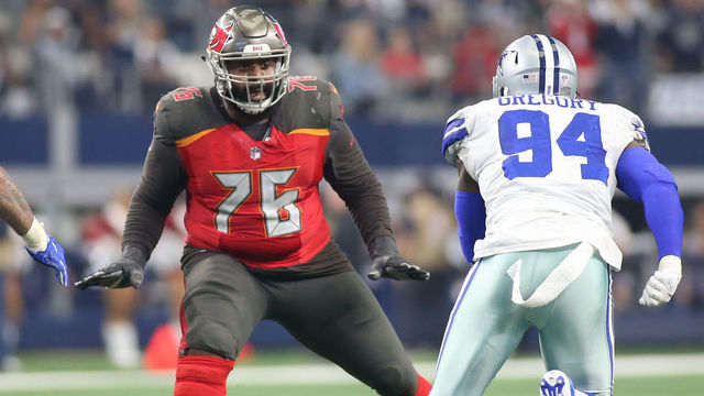 ARLINGTON, TX - DECEMBER 23: Tampa Bay Buccaneers Offensive Tackle Donovan Smith (76) pass blocks during the game between the Tampa Bay Buccaneers and Dallas Cowboys on December 23, 2018 at AT&T Stadium in Arlington, TX.