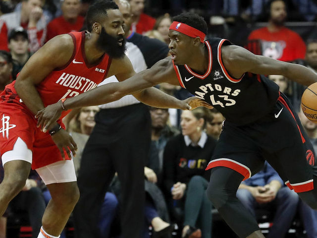 HOUSTON, TX - JANUARY 25: Pascal Siakam #43 of the Toronto Raptors dribbles the ball defended by James Harden #13 of the Houston Rockets in the first half at Toyota Center on January 25, 2019 in Houston, Texas.