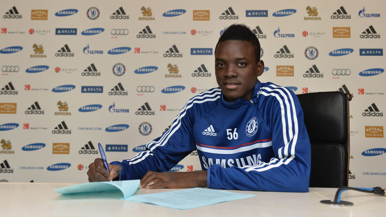 Chelsea's new signing Bertrand Traore signs his contract at the Cobham Training Ground on 1st January 2014 in Cobham, England.
