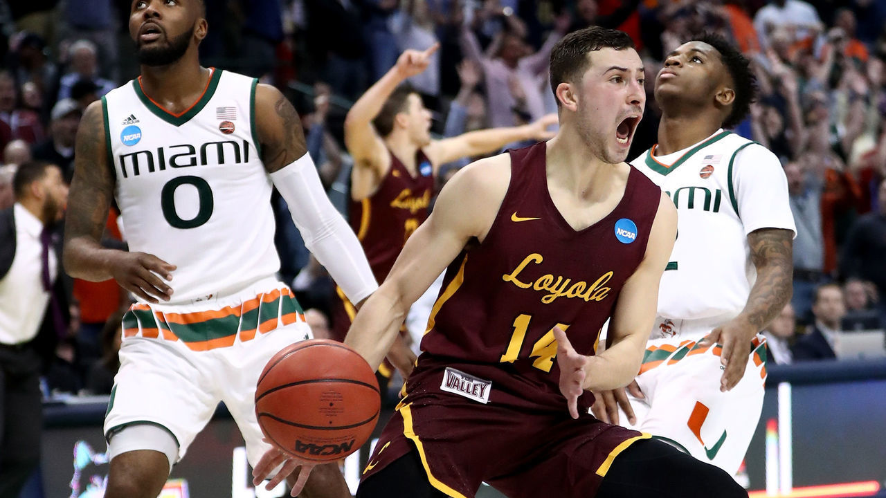 DALLAS, TX - MARCH 15: Ben Richardson #14 celebrates after Donte Ingram #0 of the Loyola Ramblers makes his game-winning three pointer against the Miami Hurricanes in the first round of the 2018 NCAA Men's Basketball Tournament at American Airlines Center on March 15, 2018 in Dallas, Texas.