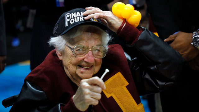 ATLANTA, GA - MARCH 24: Sister Jean Dolores Schmidt celebrates with the Loyola Ramblers after defeating the Kansas State Wildcats during the 2018 NCAA Men's Basketball Tournament South Regional at Philips Arena on March 24, 2018 in Atlanta, Georgia. Loyola defeated Kansas State 78-62