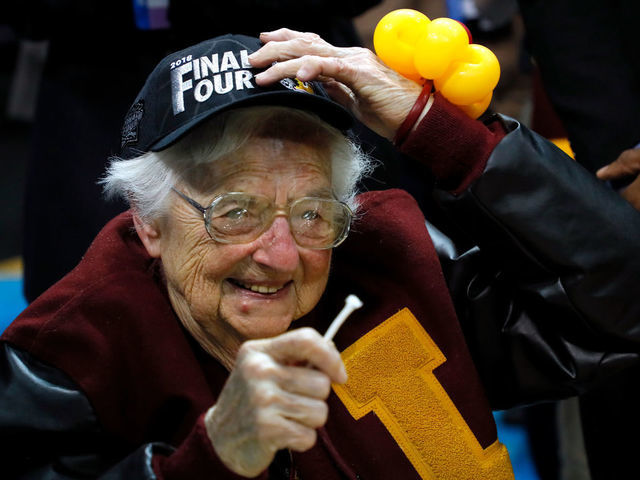 ATLANTA, GA - MARCH 24: Sister Jean Dolores Schmidt celebrates with the Loyola Ramblers after defeating the Kansas State Wildcats during the 2018 NCAA Men's Basketball Tournament South Regional at Philips Arena on March 24, 2018 in Atlanta, Georgia. Loyola defeated Kansas State 78-62