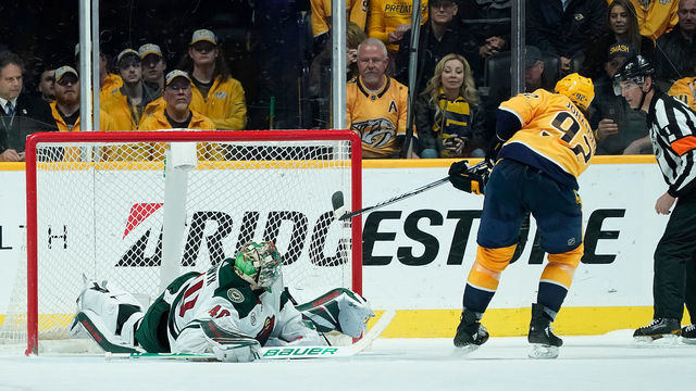 NASHVILLE, TN - MARCH 5: Ryan Johansen #92 of the Nashville Predators scores the game winning shootout goal against Devan Dubnyk #40 of the Minnesota Wild at Bridgestone Arena on March 5, 2019 in Nashville, Tennessee.