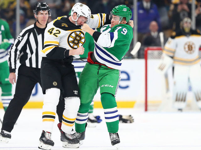 BOSTON, MASSACHUSETTS - MARCH 05: David Backes #42 of the Boston Bruins and Micheal Ferland #79 of the Carolina Hurricanes fight during the first period at TD Garden on March 05, 2019 in Boston, Massachusetts.